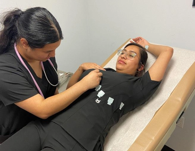 {{ school.name }} students training patient procedures